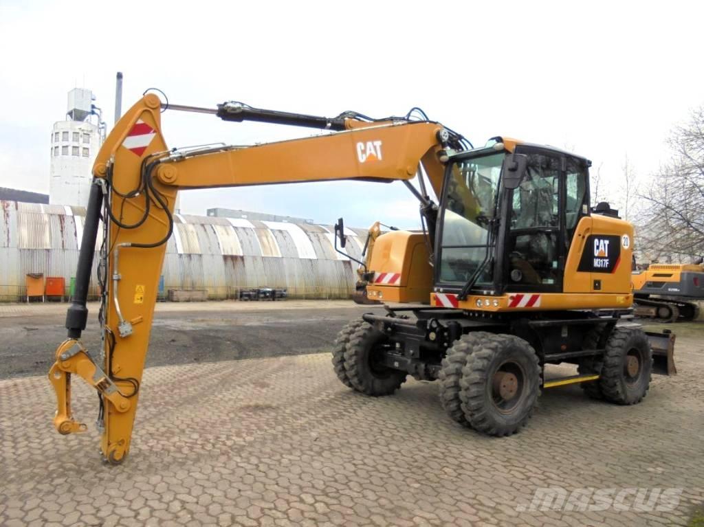 CAT M 317 حفارات بعجل