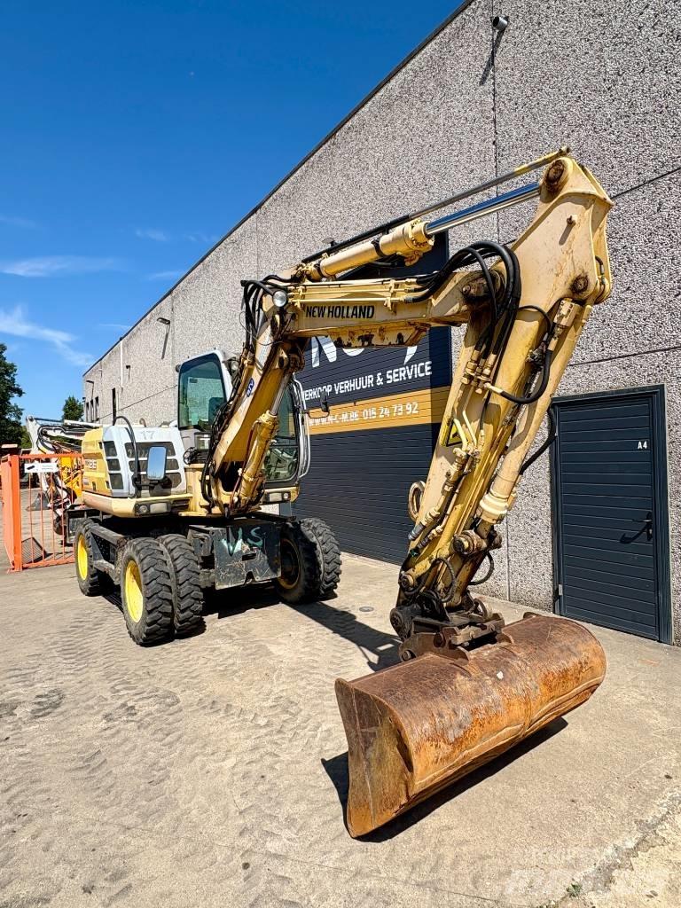 New Holland MH 2.6 حفارات بعجل
