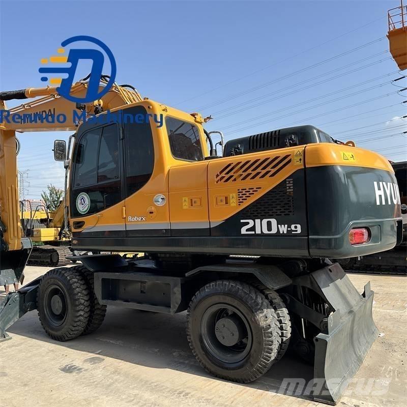 Hyundai 210W-9 حفارات بعجل