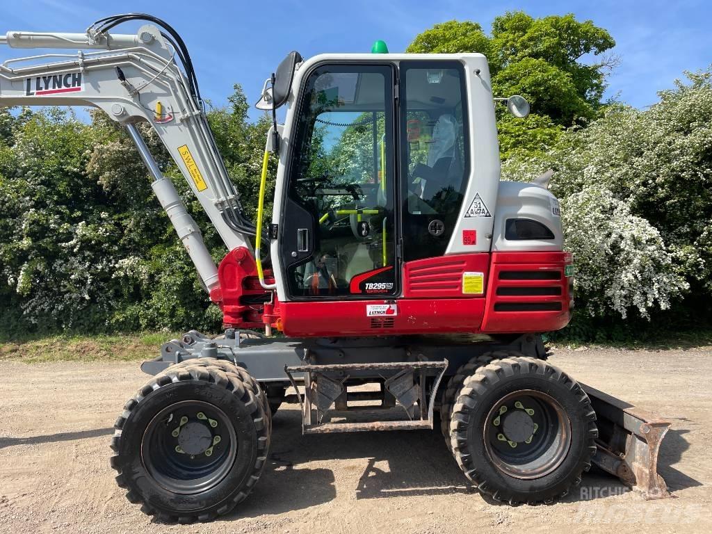 Takeuchi TB 295 W حفارات بعجل