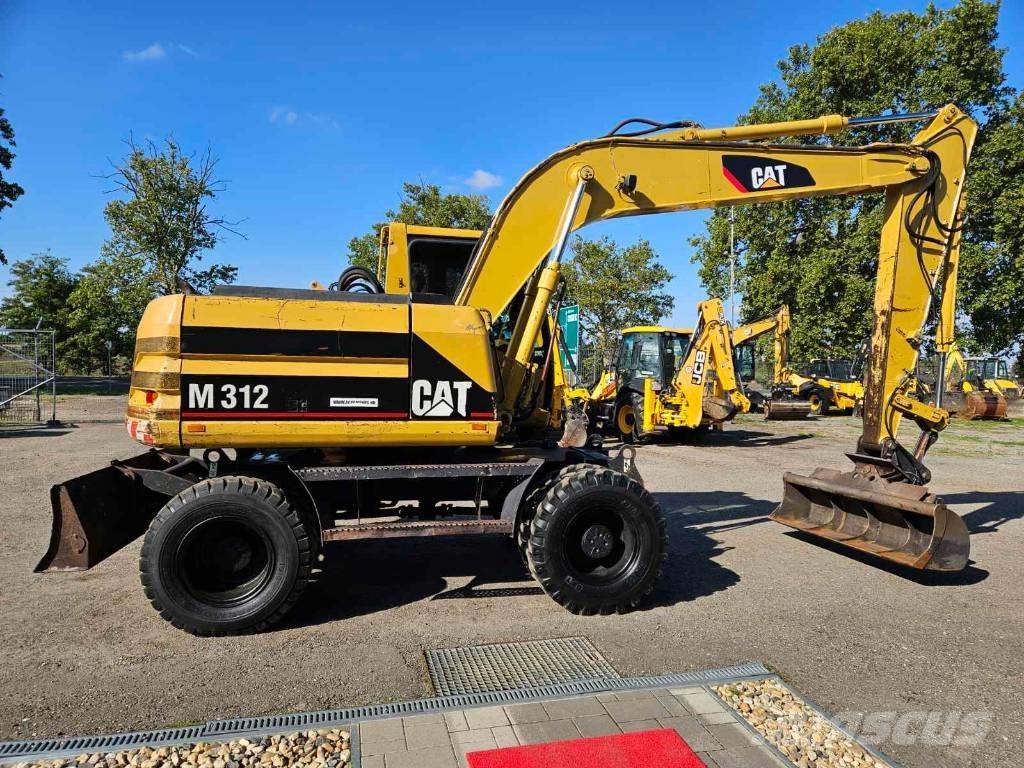 CAT M 312 حفارات بعجل