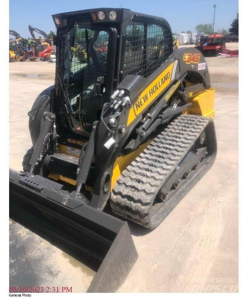 New Holland C345 لوادر انزلاقية التوجيه