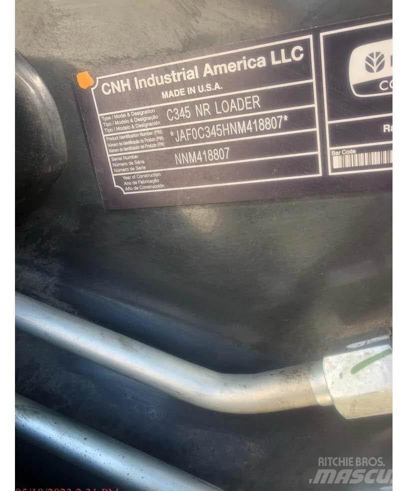 New Holland C345 لوادر انزلاقية التوجيه
