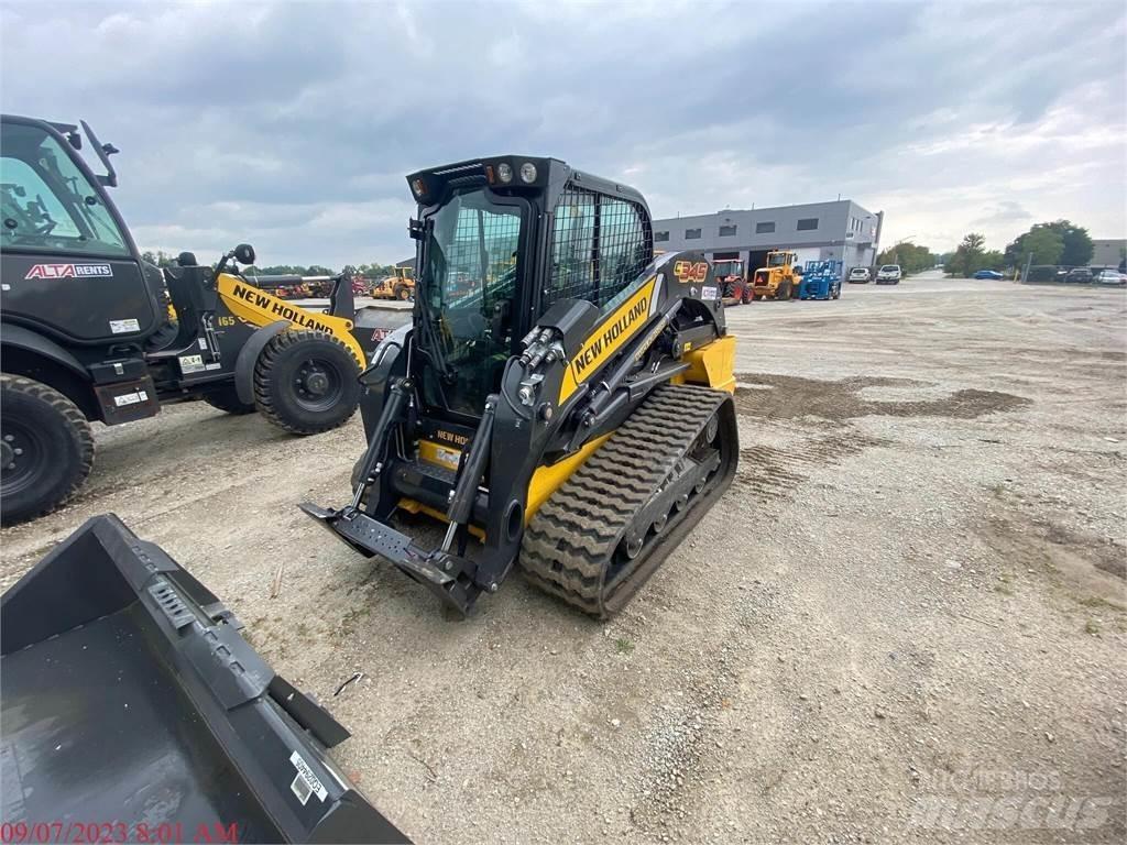 New Holland C345 لوادر انزلاقية التوجيه
