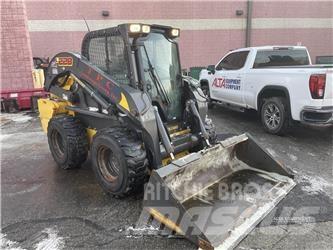 New Holland L228 لوادر انزلاقية التوجيه