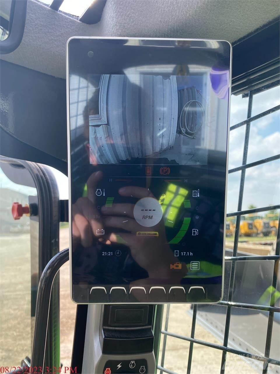 New Holland L328 لوادر انزلاقية التوجيه