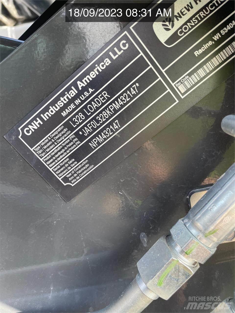 New Holland L328 لوادر انزلاقية التوجيه