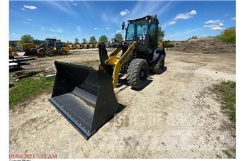 New Holland W80C لوادر بعجل
