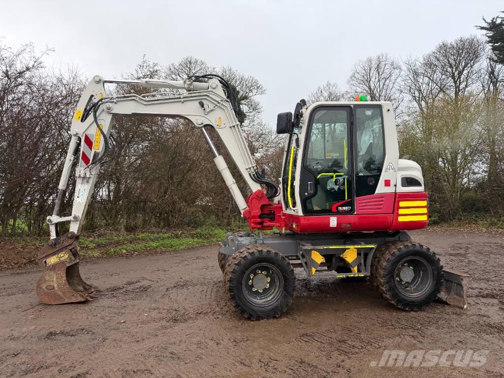 Takeuchi TB 295 W حفارات بعجل