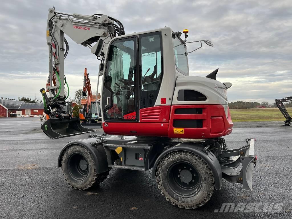 Takeuchi TB 395 W حفارات بعجل