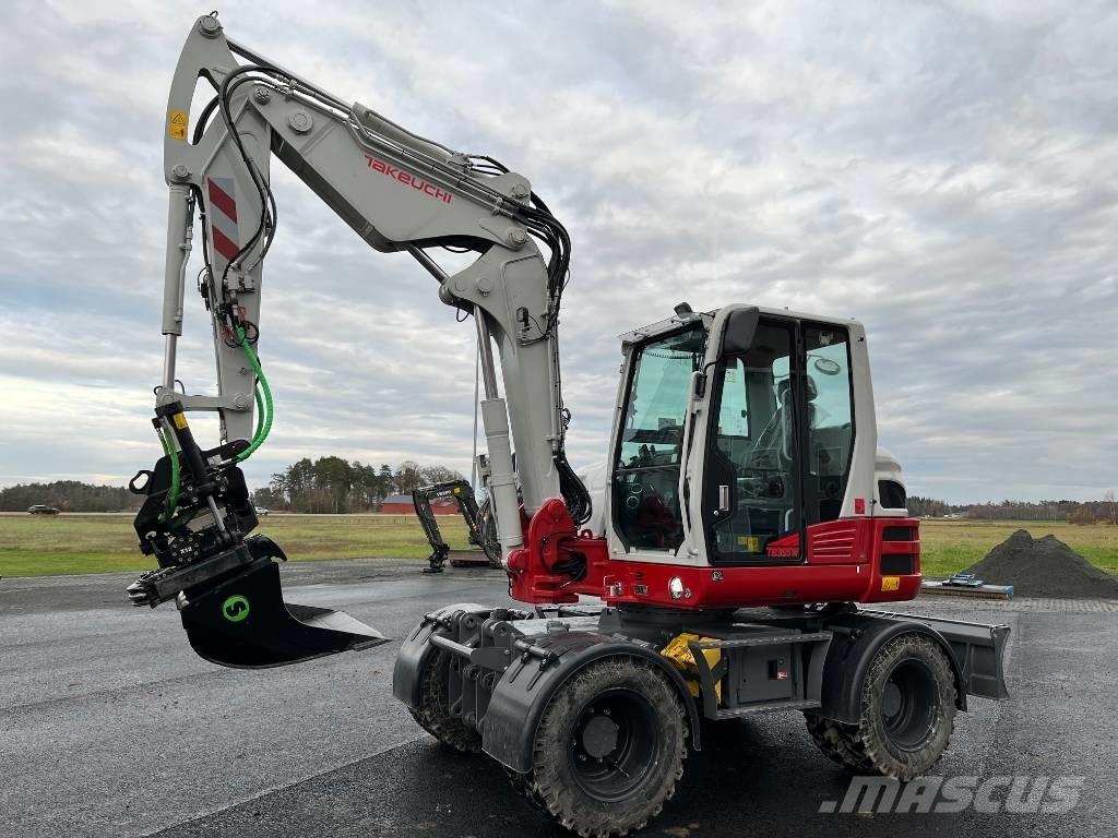 Takeuchi TB 395 W حفارات بعجل