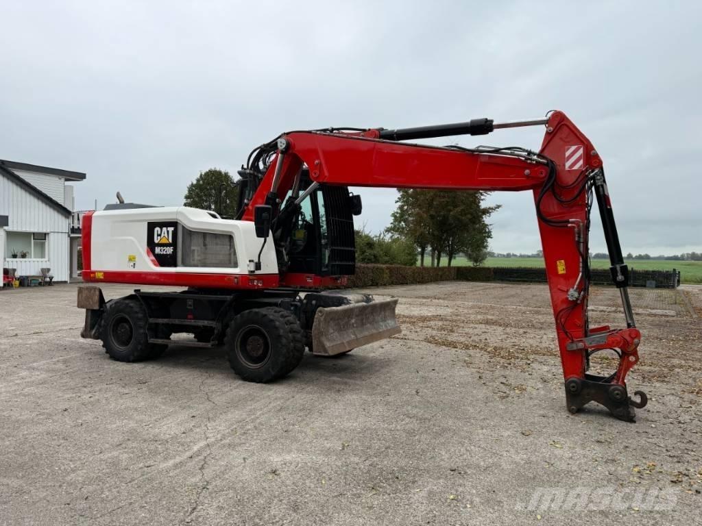CAT M320F حفارات بعجل