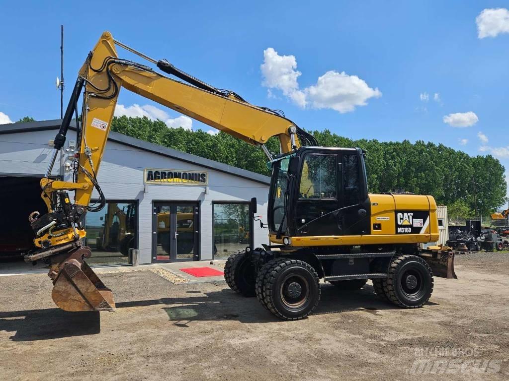 CAT M 316 D حفارات بعجل