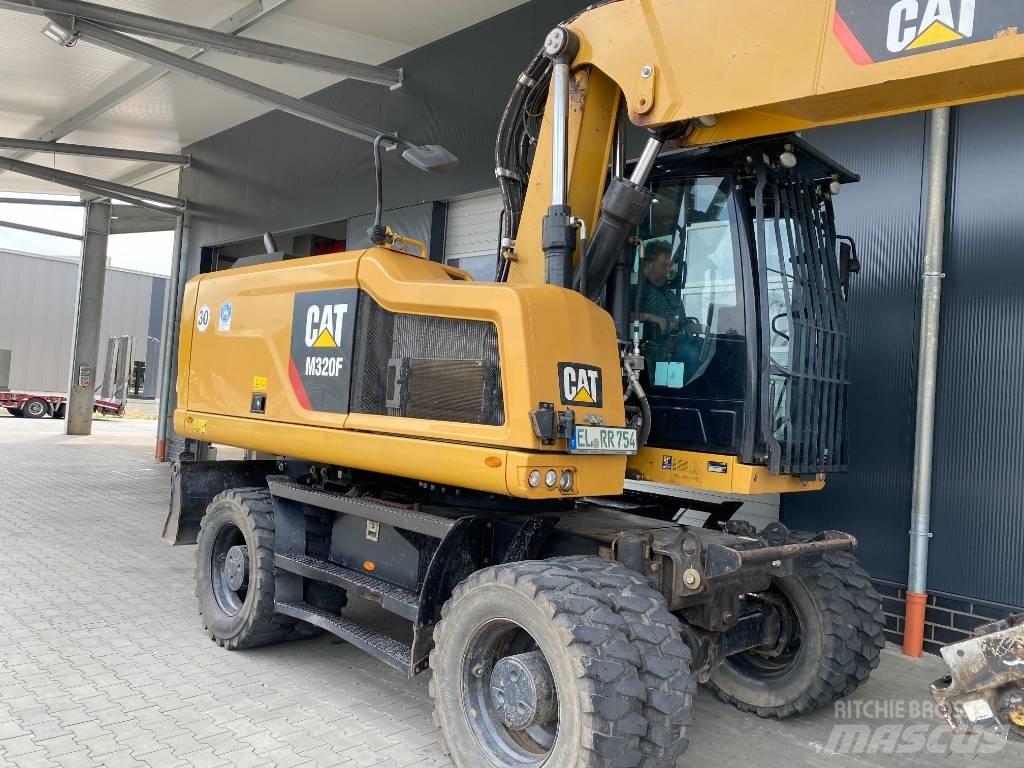 CAT M 320 F حفارات بعجل