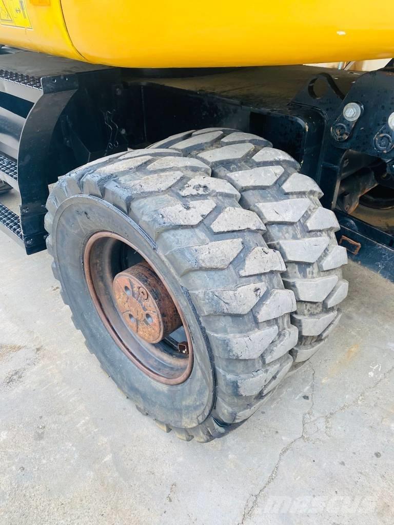CAT m317f حفارات بعجل