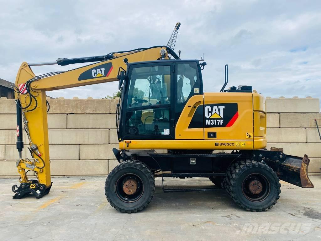 CAT m317f حفارات بعجل