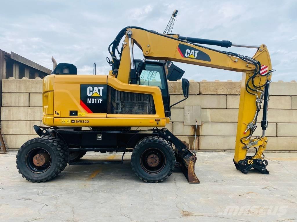 CAT m317f حفارات بعجل