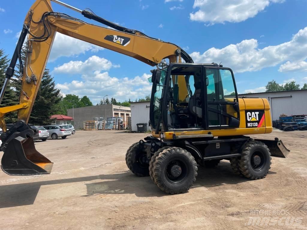 CAT M 313 D حفارات بعجل
