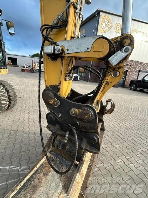 CAT M 318 F حفارات بعجل