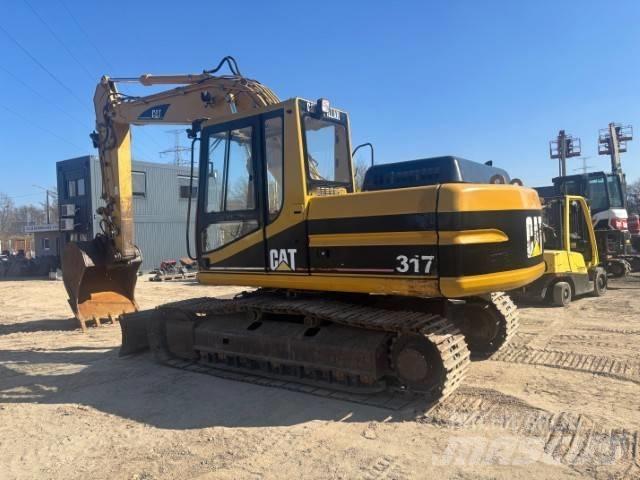CAT 317 B L حفارات زحافة