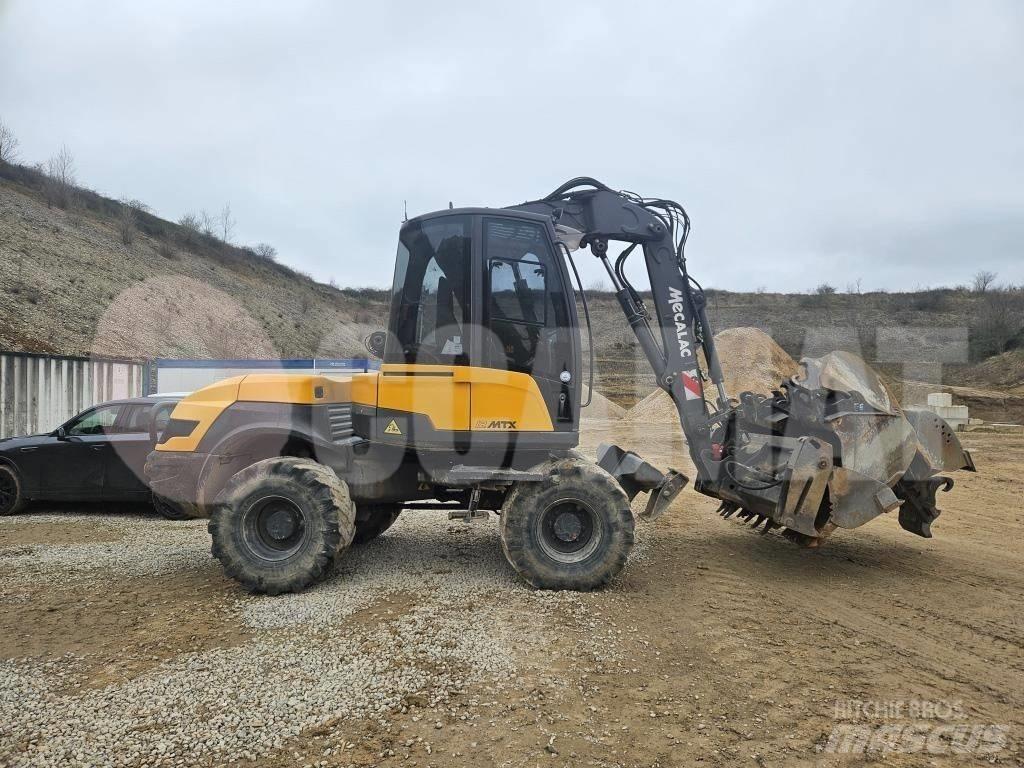 Mecalac 12 M TX حفارات بعجل