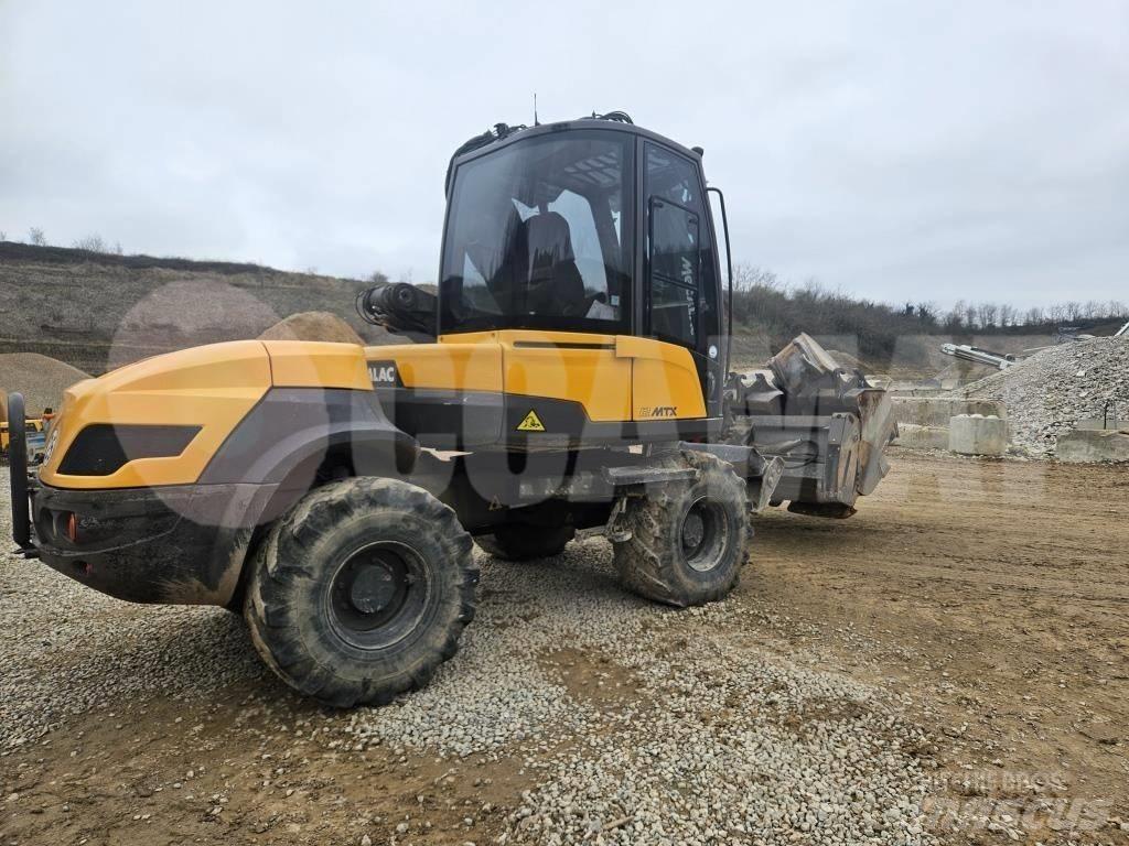 Mecalac 12 M TX حفارات بعجل