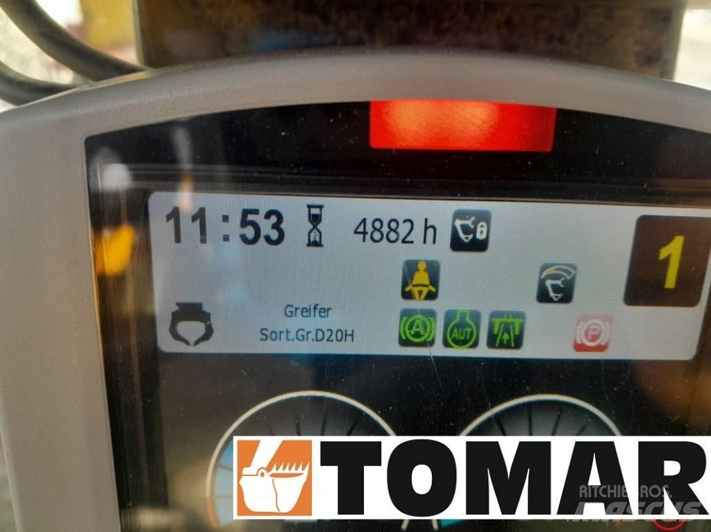 CAT M 314 F حفارات بعجل