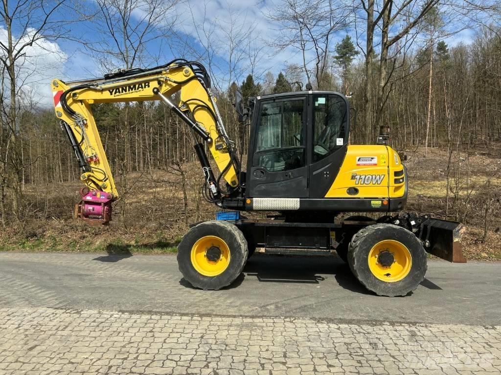 Yanmar B 110 W حفارات بعجل