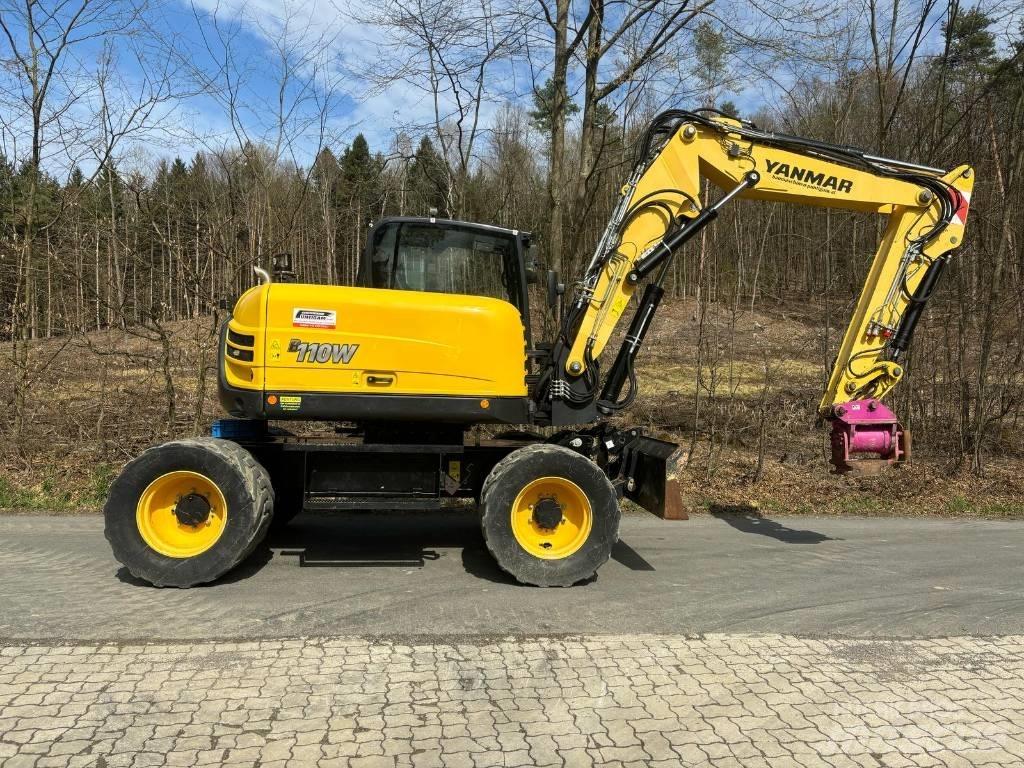 Yanmar B 110 W حفارات بعجل