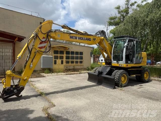 New Holland WE 170 C حفارات بعجل