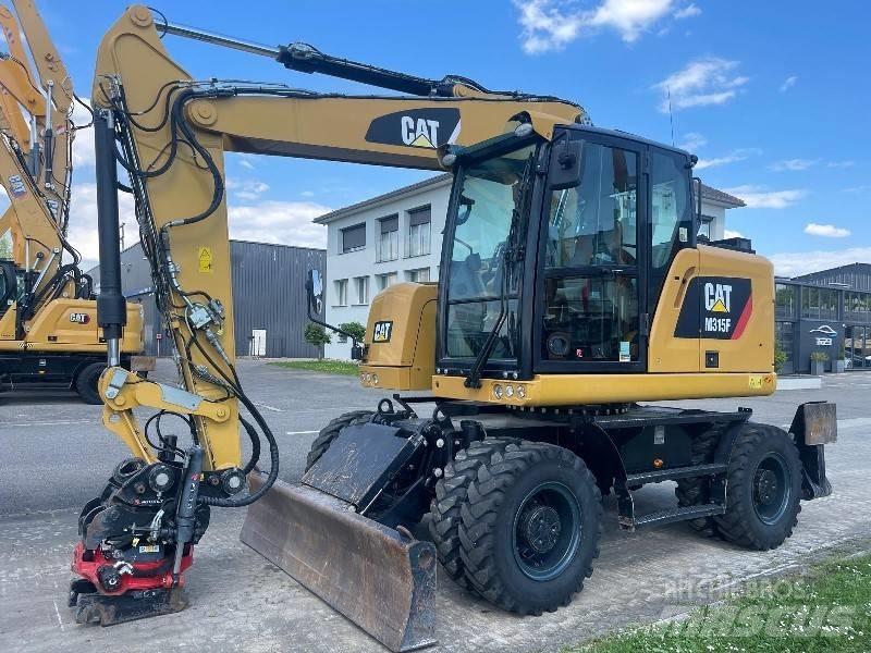 CAT M 315 F حفارات بعجل