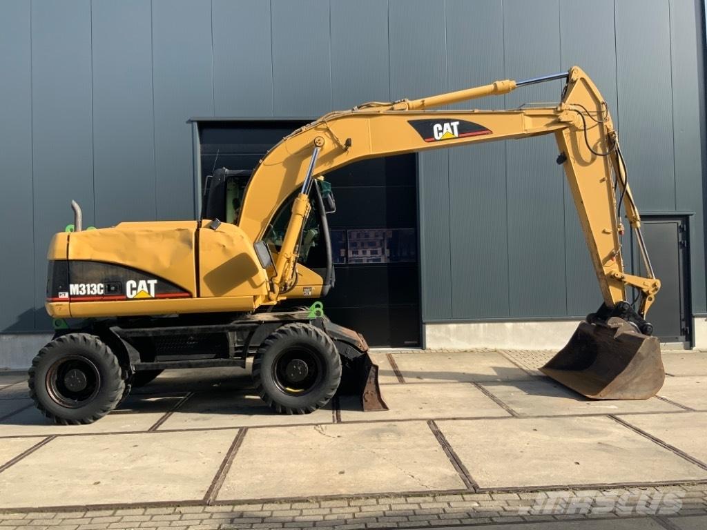 CAT M 313 C حفارات بعجل