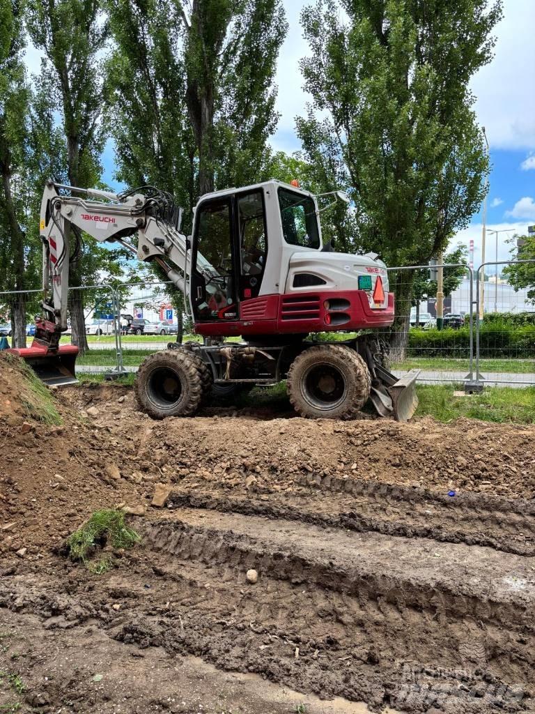 Takeuchi TB295W حفارات بعجل