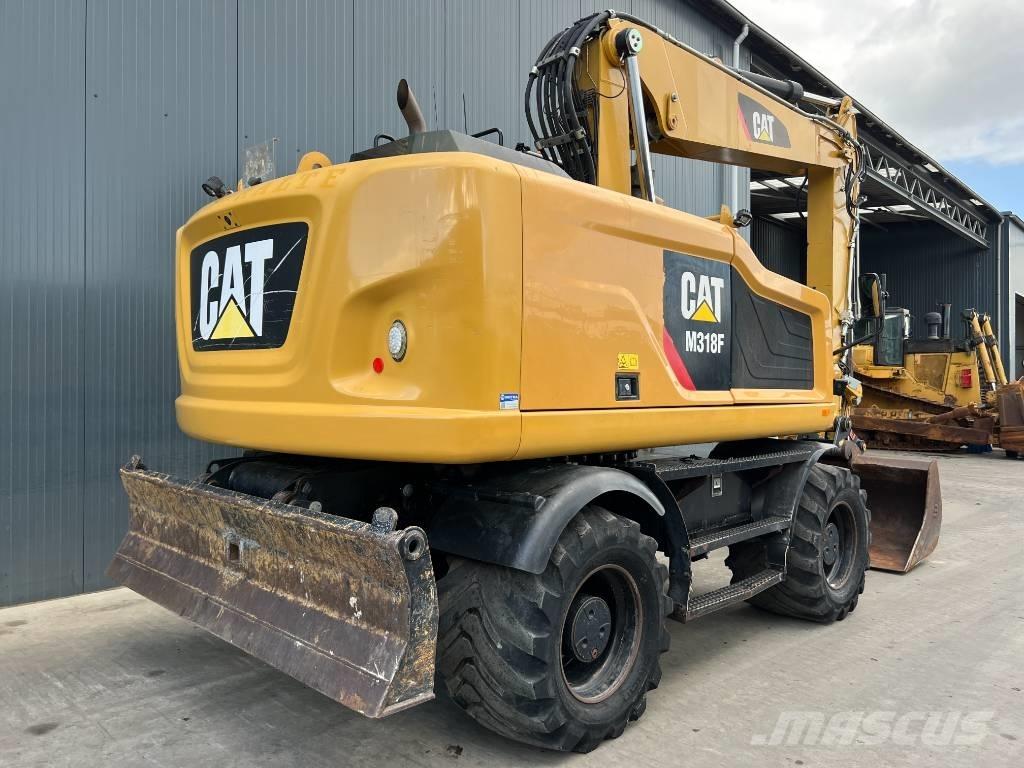 CAT M318F حفارات بعجل