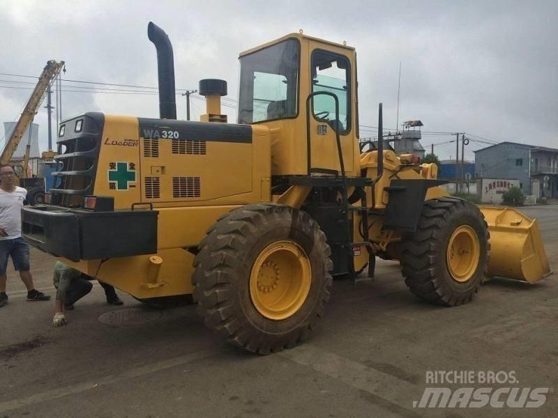 Komatsu WA 320 لوادر ذات جرافات عكسية