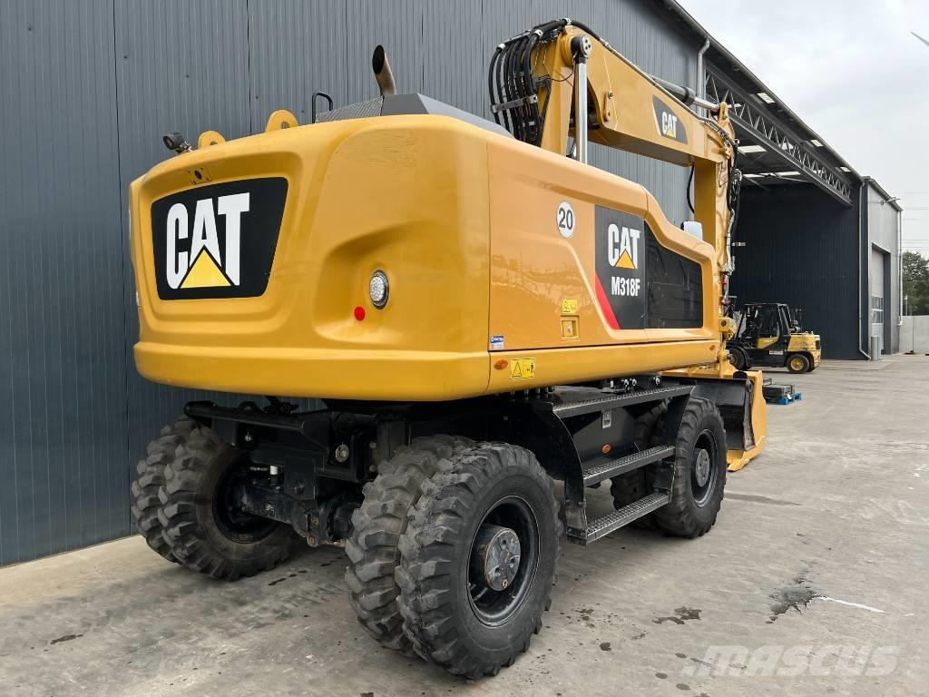 CAT M318F حفارات بعجل