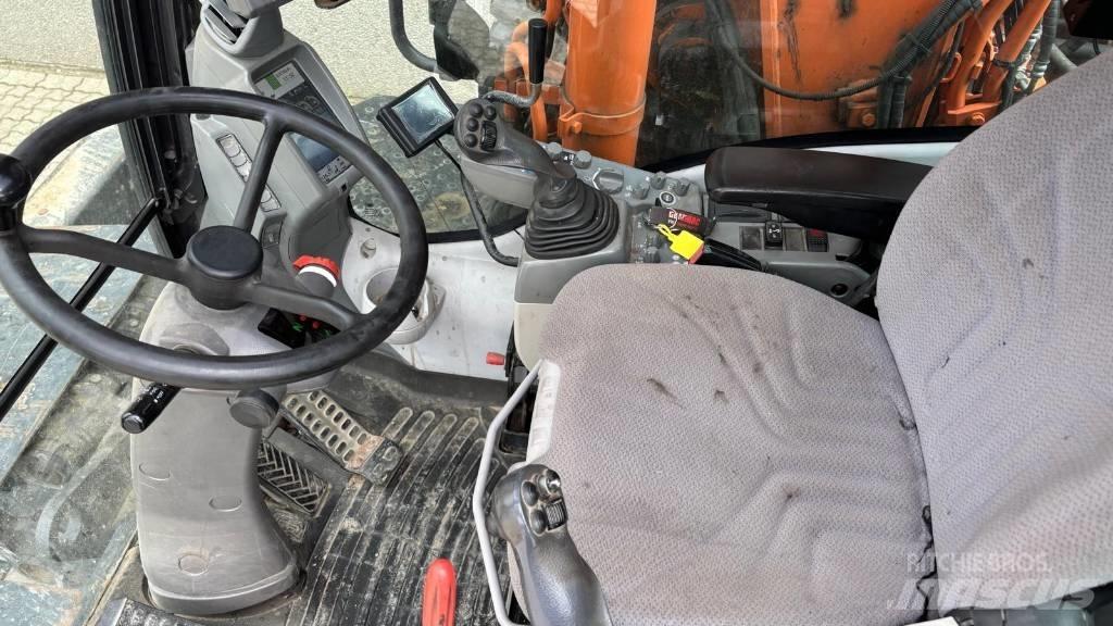 Hitachi ZX 140 W-5 حفارات بعجل