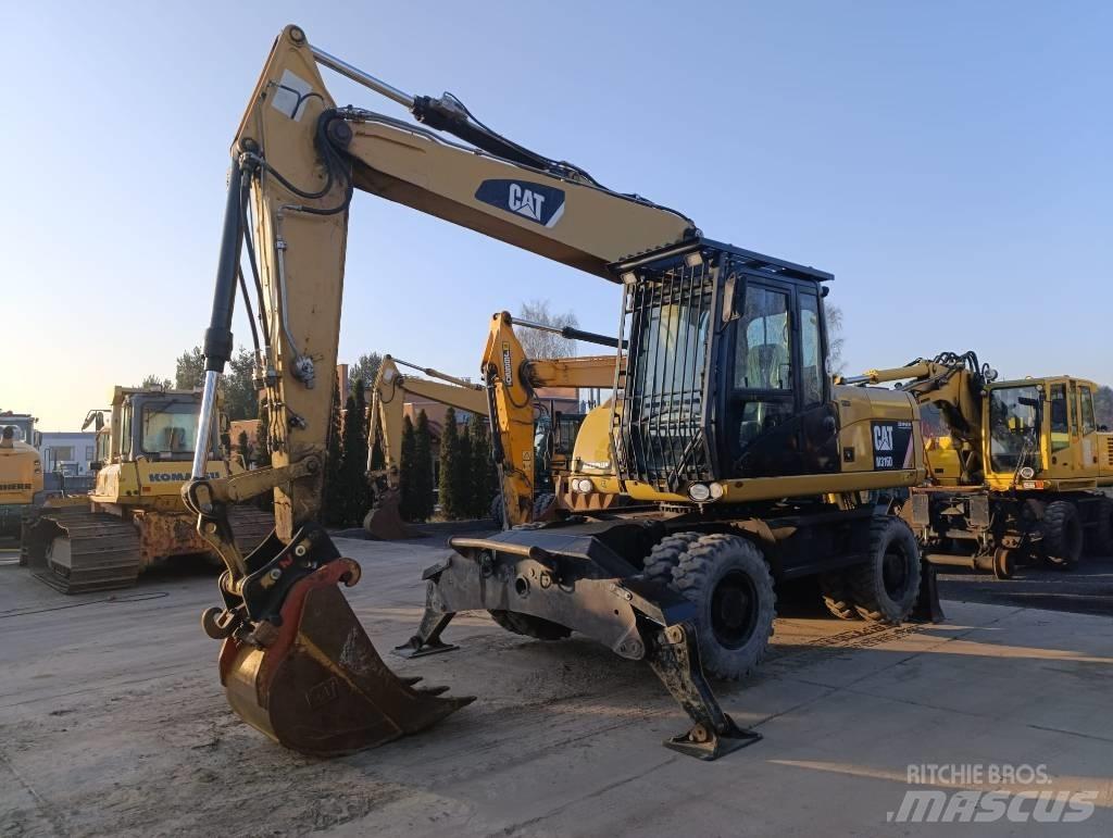 CAT M 316 D حفارات بعجل