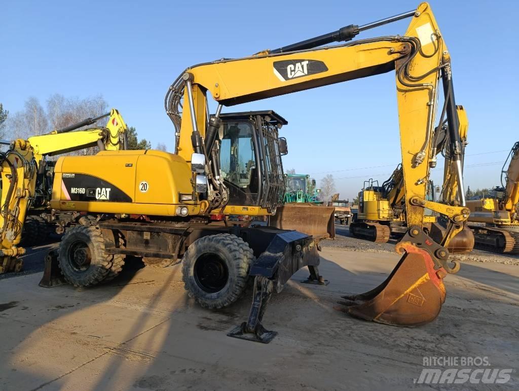 CAT M 316 D حفارات بعجل