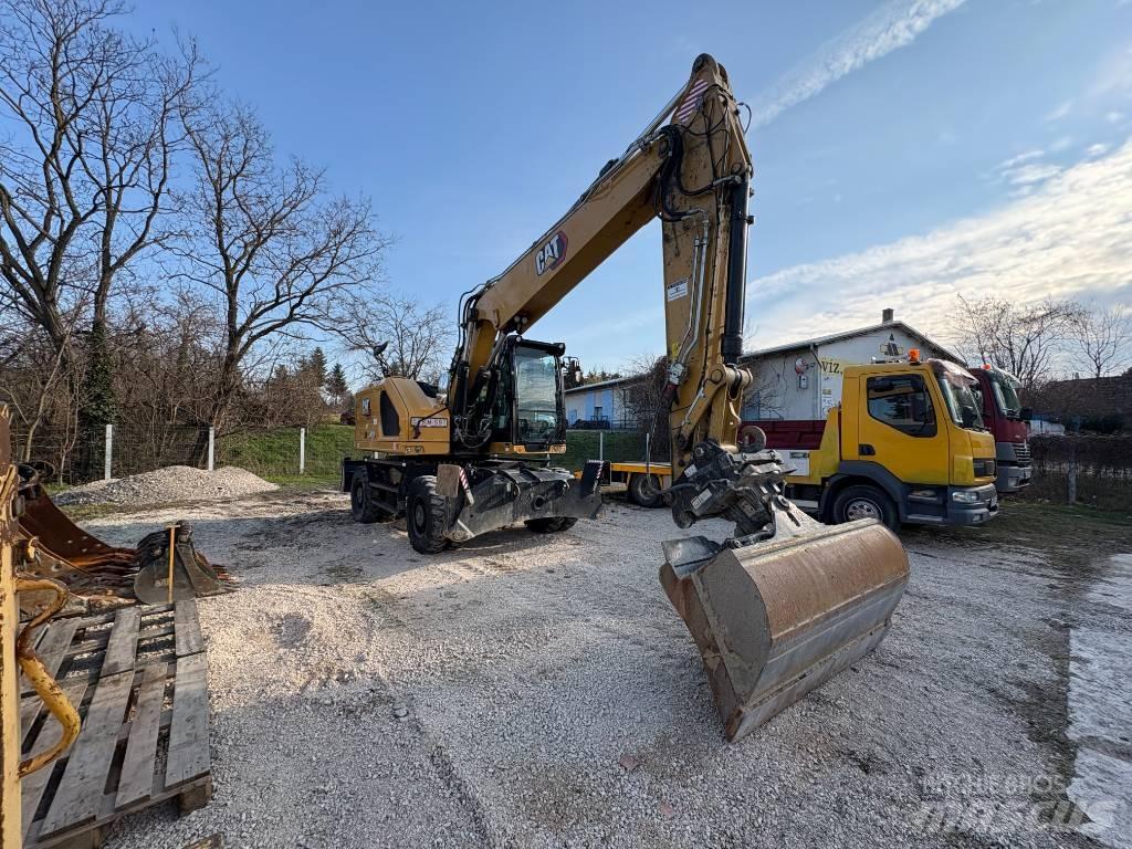 CAT M 318 حفارات بعجل