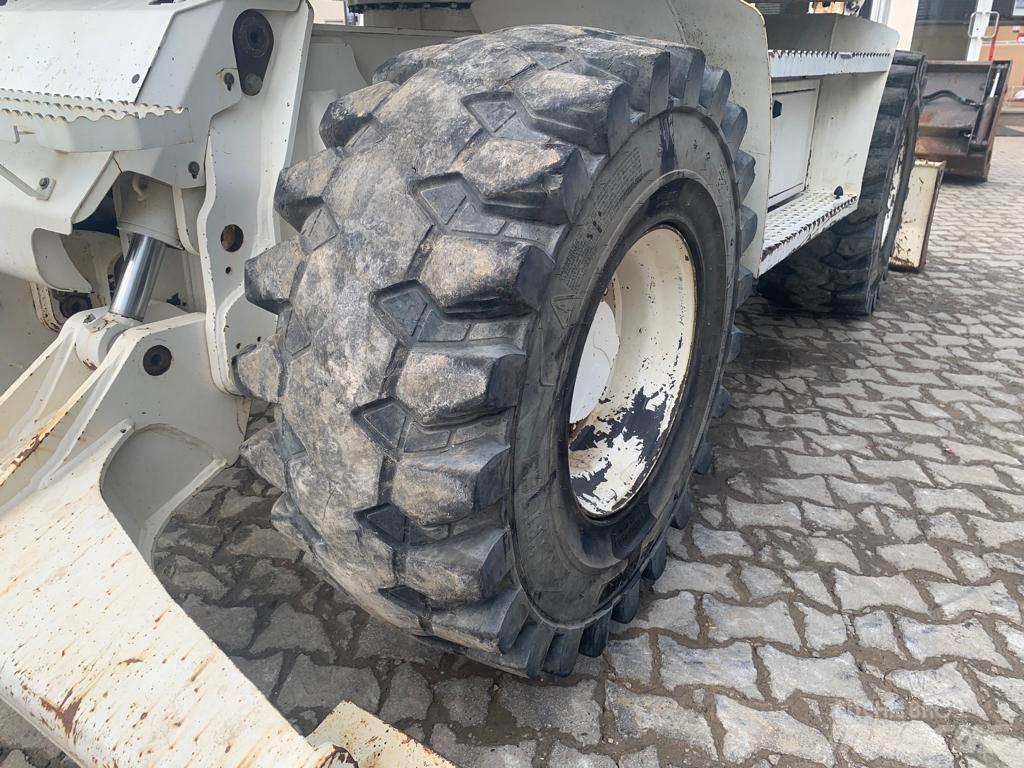 Mecalac 714 MW حفارات بعجل