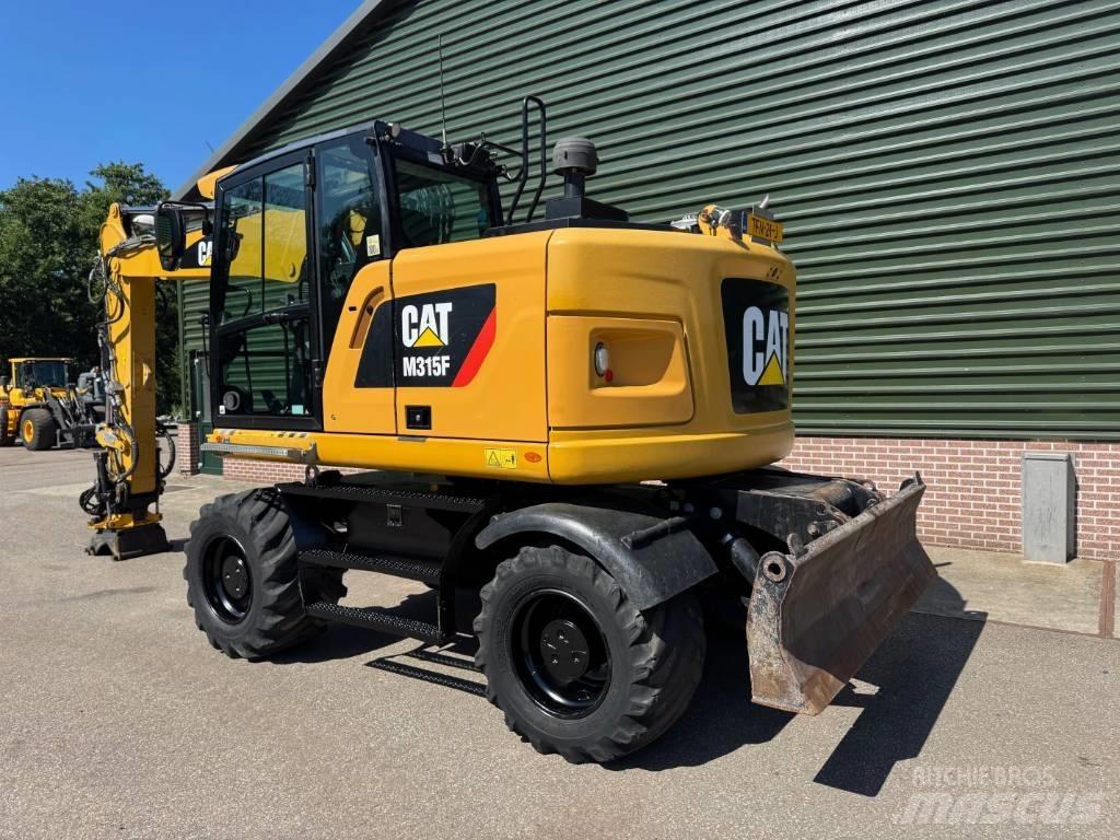 CAT M 315 F حفارات بعجل