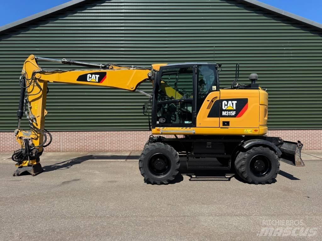 CAT M 315 F حفارات بعجل