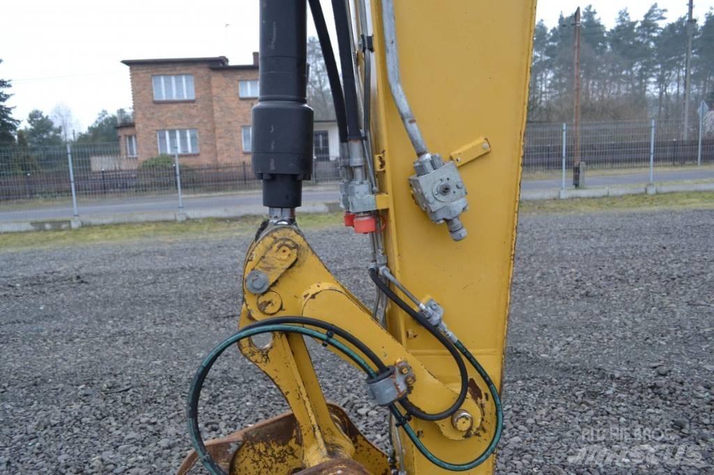 CAT M 315 D حفارات بعجل