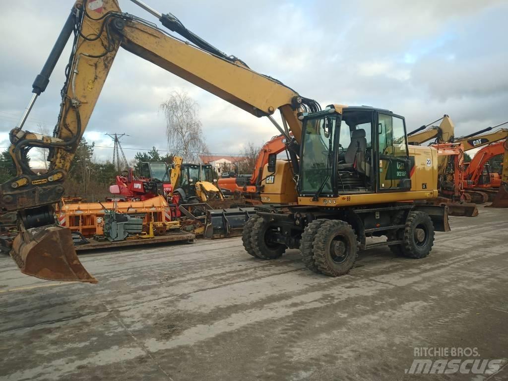 CAT M 318 F حفارات بعجل