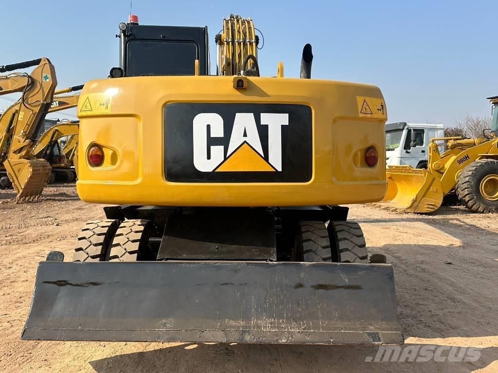 CAT M 320D حفارات بعجل