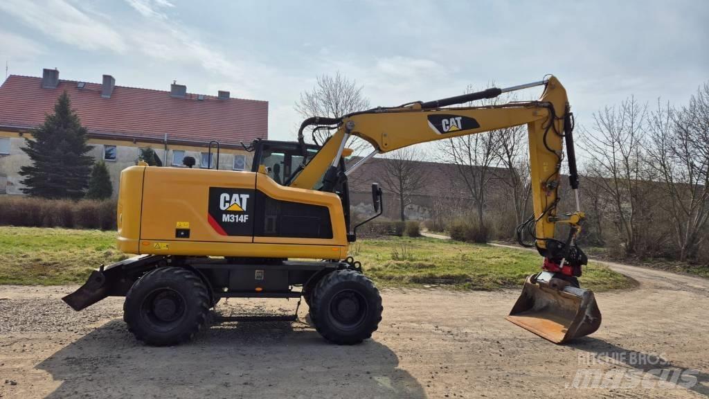 CAT M 314 F حفارات بعجل