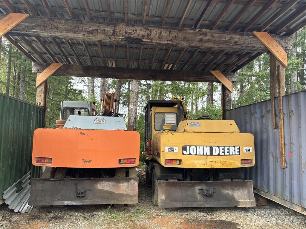DEERE 595D حفارات بعجل