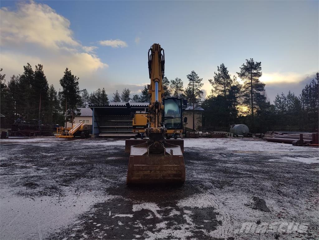 CAT M135 حفارات بعجل