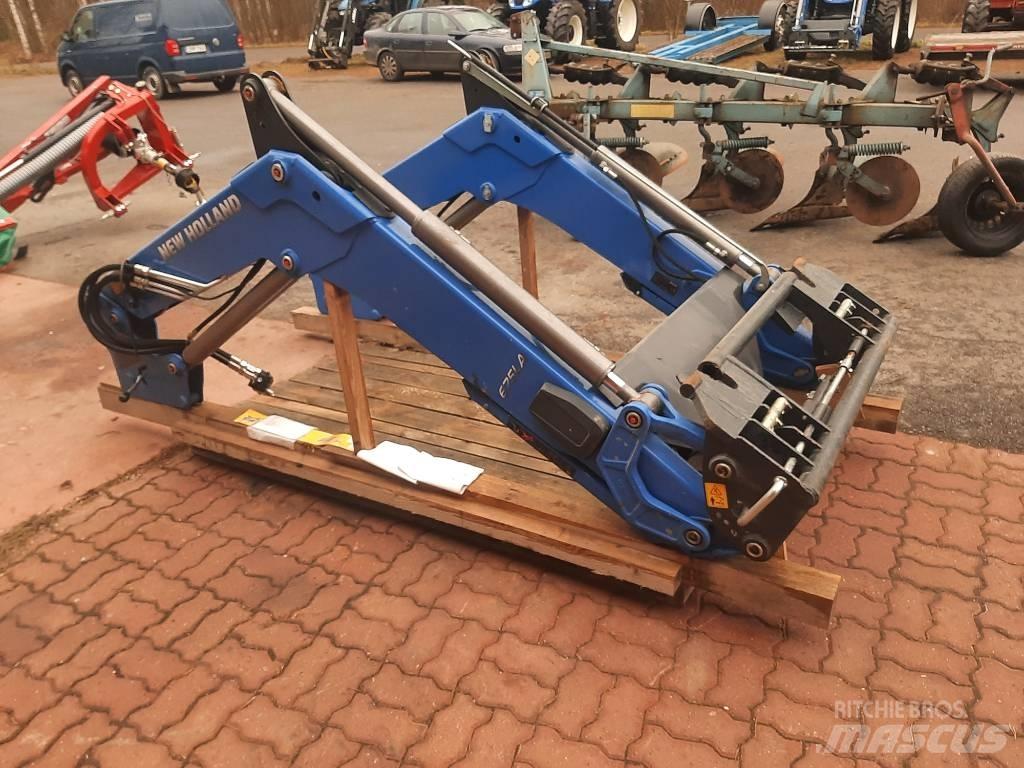 New Holland 675 LA لوادر وحفارات أمامية